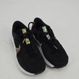 Nike Black Sneakers with White and Metallic Accents